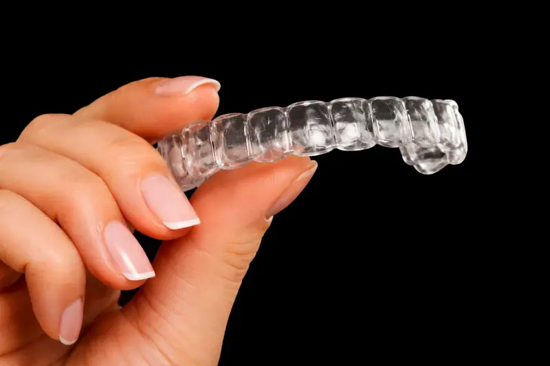 Smiling teenager with orthodontic braces