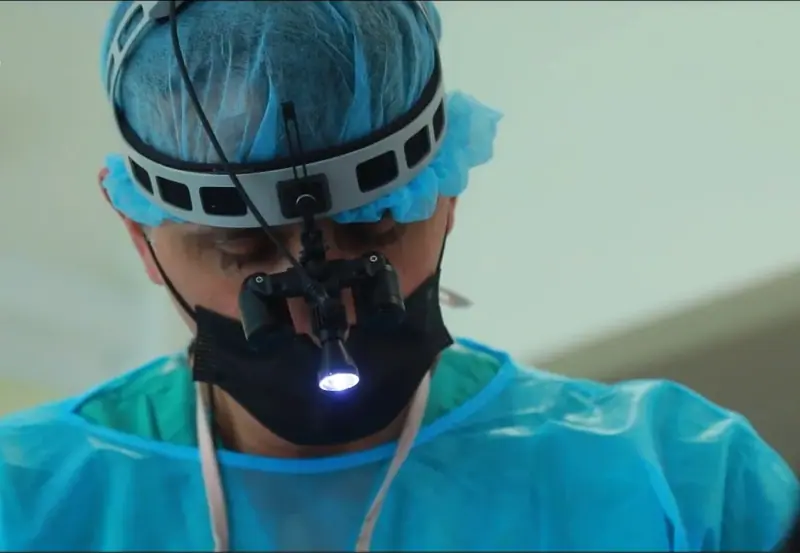 Dentist removing a wisdom tooth in the treatment room
